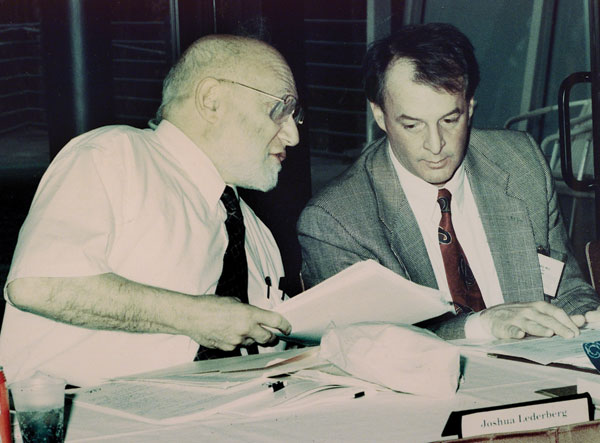 Institute of Medicine co-chair Joshua Lederberg (left) in conversation with James M. Hughes, director, National Center for Infectious Diseases, Centers for Disease Control and Prevention (CDC), during a meeting in 1993 with expert consultants on development of the first CDC emerging infectious disease strategy.