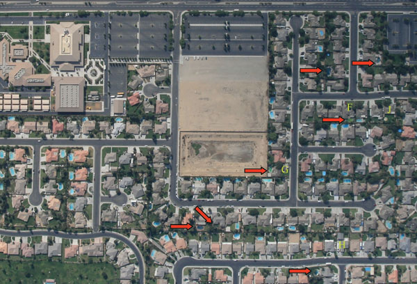 Aerial photograph of a representative Bakersfield, California, neighborhood taken during August 2007. Red arrows indicate neglected or green swimming pools. Letters (F, G, H, J) are photographic reference points.