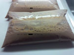 Thumbnail of Bags of pasteurized chocolate milk as sold in Canada, with outer bag containing brand information removed. A bag of milk similar to these, found at the home of 1 case-patient during investigation of an outbreak of Listeria monocytogenes infection associated with pasteurized chocolate milk in Ontario, Canada, was found to be contaminated with the same strain obtained from infected patients.