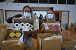 Workers at Kōkiri Marae preparing food and sanitation packages for the Lower Hutt and Wainuiomata communities during COVID-19 pandemic, New Zealand. Photograph by Luke Pilkinton-Ching, University of Otago, Wellington, New Zealand.