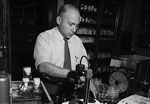 Molecular biologist and Nobel laureate Joshua Lederberg in his laboratory in Wisconsin, 1958. Dr. Lederberg played a pivotal role in coining the term microbiome as we know it today. Public domain image from the National Library of Medicine.