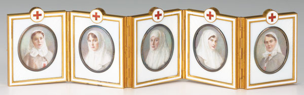 Concealed inside this egg is a hinged, folding screen that displays 5 miniature portraits of the tsar’s mother, sister, daughters, and cousin wearing Red Cross uniforms. Each portrait is encased in white enamel, mounted in gold, and backed with mother of pearl. The screen is signed by craftsman Vassilii Zuiev.